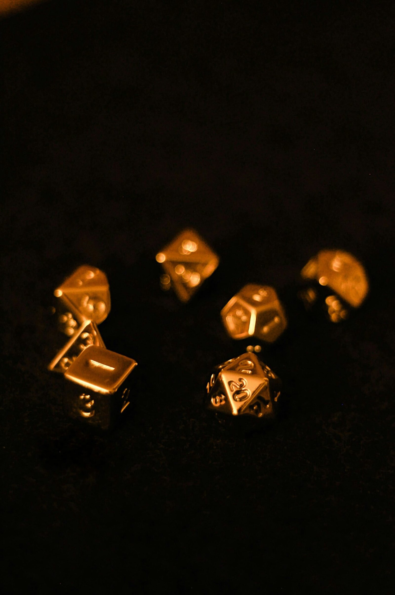 a group of gold dices sitting on top of a table